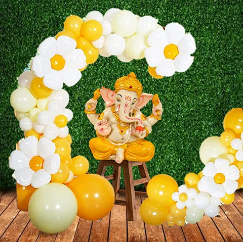 Playful balloon decorations, including vibrant balloon arches and a Ganesha sculpture crafted entirely from balloons.